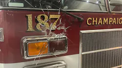 An apparatus bay door window that was pierced by gunfire at Champaign, IL, Fire Station 1 on Sunday, Oct. 10, 2021.