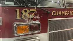 An apparatus bay door window that was pierced by gunfire at Champaign, IL, Fire Station 1 on Sunday, Oct. 10, 2021.