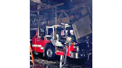 An aerial apparatus is badly damaged after a fire erupted inside a Dunellen, NJ, fire station on Tuesday, Oct. 12, 2021.