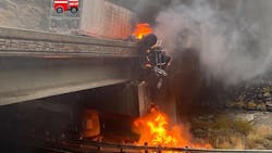 A burning semi truck hangs off the side of a bridge in Floriston, CA, after a crash on Sunday, Oct. 24, 2021. A burning semi truck hangs off the side of a bridge in Floriston, CA, after a crash on Sunday, Oct. 24, 2021.