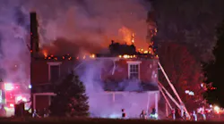 Flames engulf the upper floor and roof of a historic farmhouse in Hellam Township, PA, on Monday, Oct. 25, 2021.