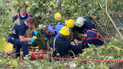 Pittsburgh Bureau of Fire, EMS, and Police from Zone 3 tend to a man who was injured when a stalled car he was pushing dragged him over a hillside on Friday, Oct. 15, 2021. Pittsburgh Bureau of Fire, EMS, and Police from Zone 3 tend to a man who was injured when a stalled car he was pushing dragged him over a hillside on Friday, Oct. 15, 2021.