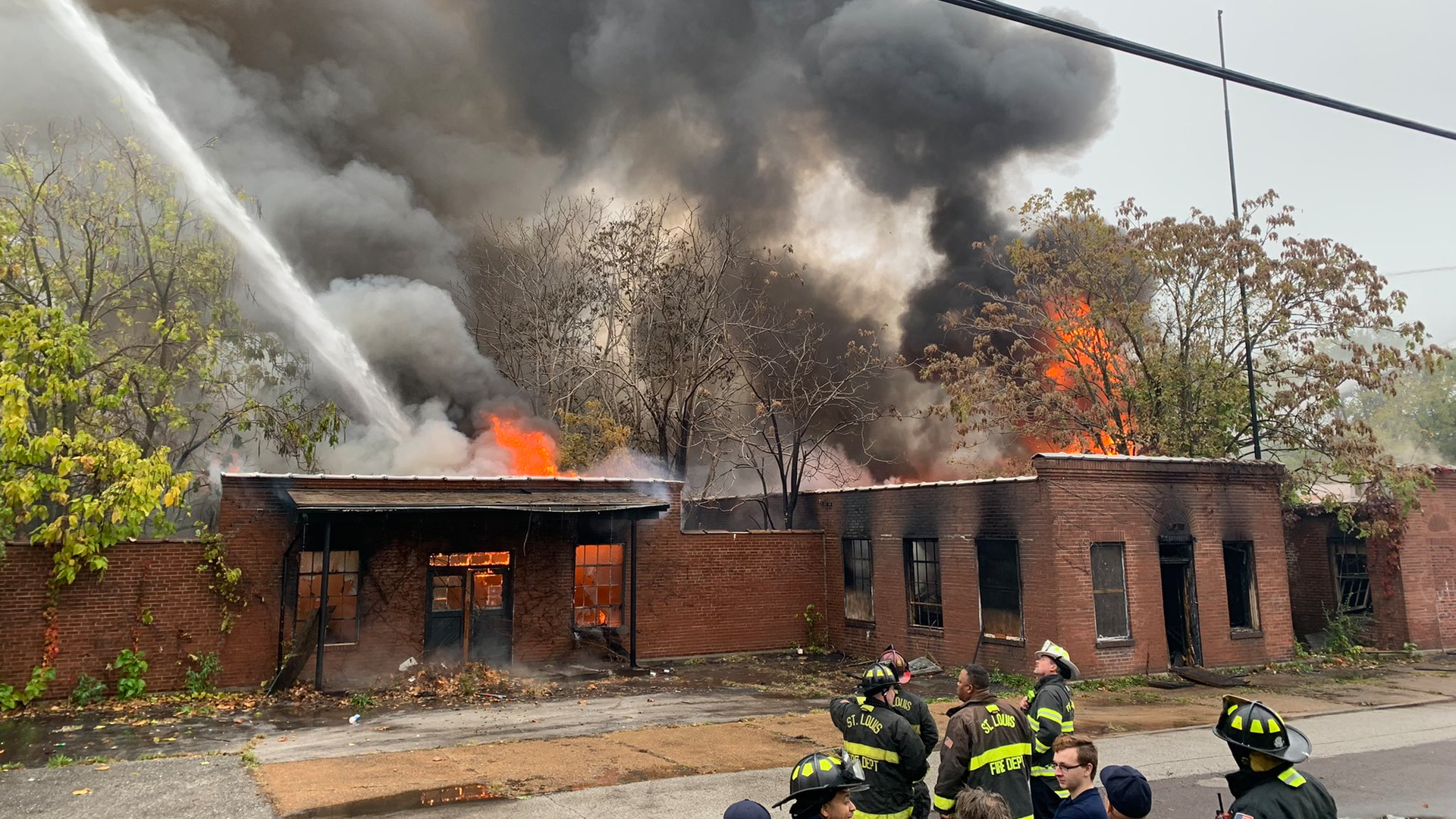 A four-alarm fire burns at an abandoned warehouse in Jennings, MO, on Thursday, Oct. 28, 2021.