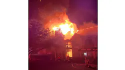 Firefighters work to extinguish a commercial fire in Myrtle Beach, SC, on Tuesday, Oct. 26, 2021.