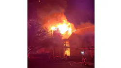 Firefighters work to extinguish a commercial fire in Myrtle Beach, SC, on Tuesday, Oct. 26, 2021.