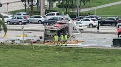 A Palm Beach County apparatus sits on its side after flipping in a collision with a pickup truck in Boca Raton, FL, on Saturday, Oct. 23, 2021.
