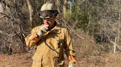Deputy Chief Eric Germain radios in a progress report at a brush fire in Carver, MA, in this undated photo.