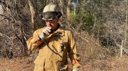 Deputy Chief Eric Germain radios in a progress report at a brush fire in Carver, MA, in this undated photo. Deputy Chief Eric Germain radios in a progress report at a brush fire in Carver, MA, in this undated photo.
