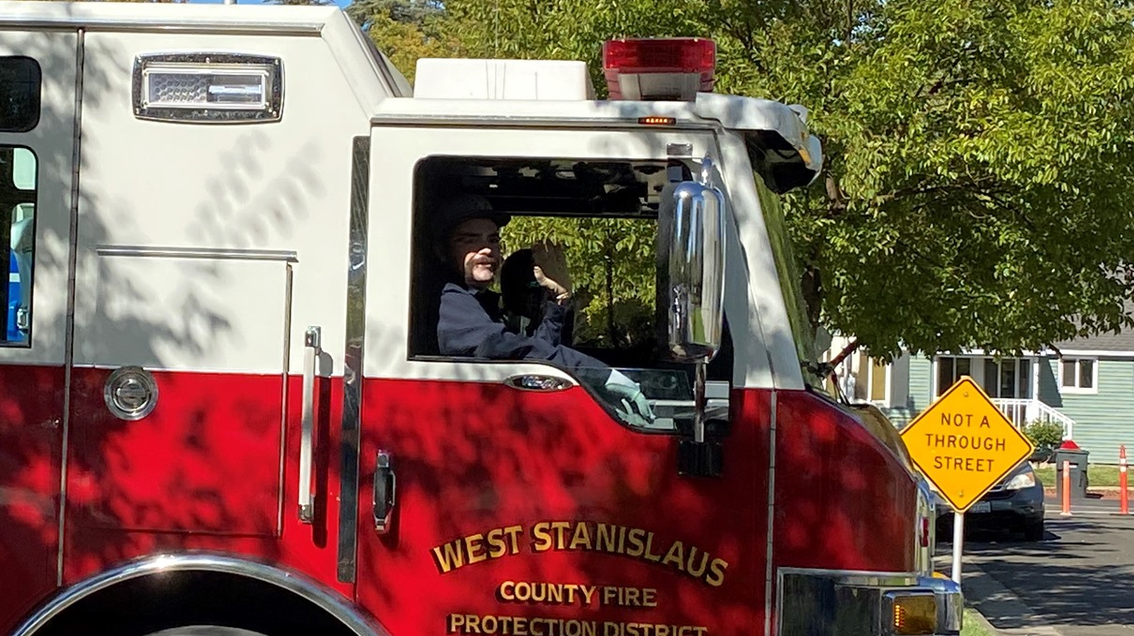 West Stanislaus firefighter Richard Gerety III gets a lift home from UC Davis Medical Center in an apparatus after undergoing treatment for severe burns he suffered battling the Caldor Fire in August.