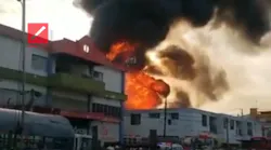 Fire engulfs a business in La Vega Wednesday that left three firefighters dead and several injured.