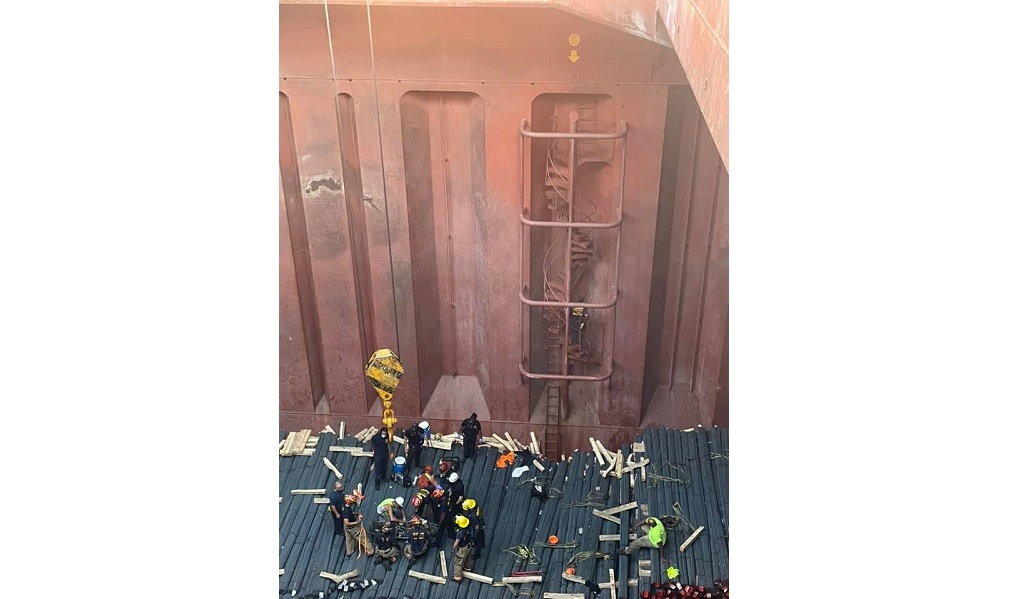 New Orleans Fire Department personnel rescuing a longshoreman who had fallen 60 feet into the hull of a cargo ship on Tuesday, Oct. 12,2021.