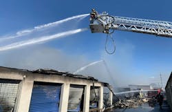 Firefighters work to extinguish a fire that tore through two buildings containing storage units in Owensboro, KY, on Thursday, Oct. 21, 2021. Firefighters work to extinguish a fire that tore through two buildings containing storage units in Owensboro, KY, on Thursday, Oct. 21, 2021.