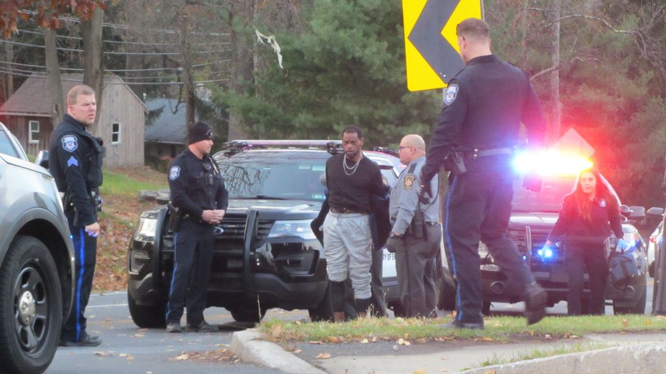 Troopers arrest a man after he drove through a crash scene and hit a firefighter with his vehicle in Williams Township, PA, on Thursday, Nov. 18, 2021.