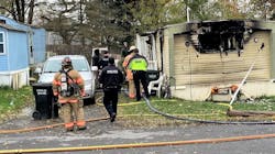 Firefighters and police investigate the scene after a fire in a DeWitt, NY, residence on Friday, Nov. 19, 2021. Firefighters and police investigate the scene after a fire in a DeWitt, NY, residence on Friday, Nov. 19, 2021.