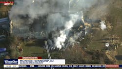 Crews from multiple communities battled a fire that spread to a burn and left one person with burn injuries in Monroe Township. Crews from multiple communities battled a fire that spread to a burn and left one person with burn injuries in Monroe Township.