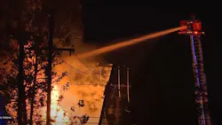 Firefighters use an aerial master stream to control a downtown Covington, LA, fire. Firefighters use an aerial master stream to control a downtown Covington, LA, fire.