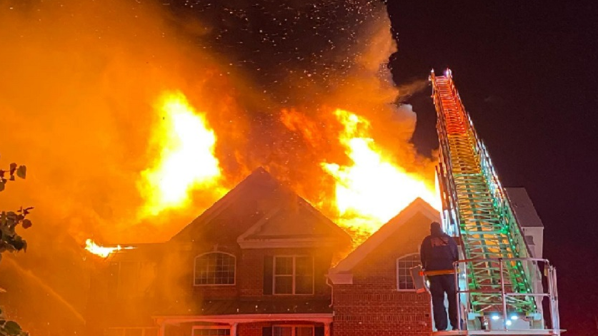 Firefighters conduct defensive operations at a single family dwelling fire on Nov. 22, 2021.