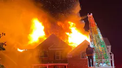 Firefighters conduct defensive operations at a single family dwelling fire on Nov. 22, 2021.