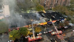 FDNY crews operating multiple aerial devices during a five-alarm commercial fire in Harlem on Wednesday, Nov. 3, 2021. FDNY crews operating multiple aerial devices during a five-alarm commercial fire in Harlem on Wednesday, Nov. 3, 2021.