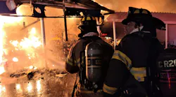 Marion County firefighters operate at a defensive commercial fire in Ocala, FL, on Thursday, Nov. 18, 2021.