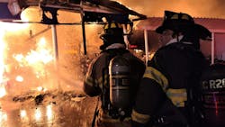 Marion County firefighters operate at a defensive commercial fire in Ocala, FL, on Thursday, Nov. 18, 2021.