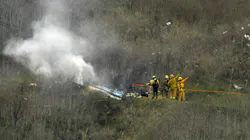 Firefighters operate at the scene of a helicopter crash that took the lives of nine people in January 2020.