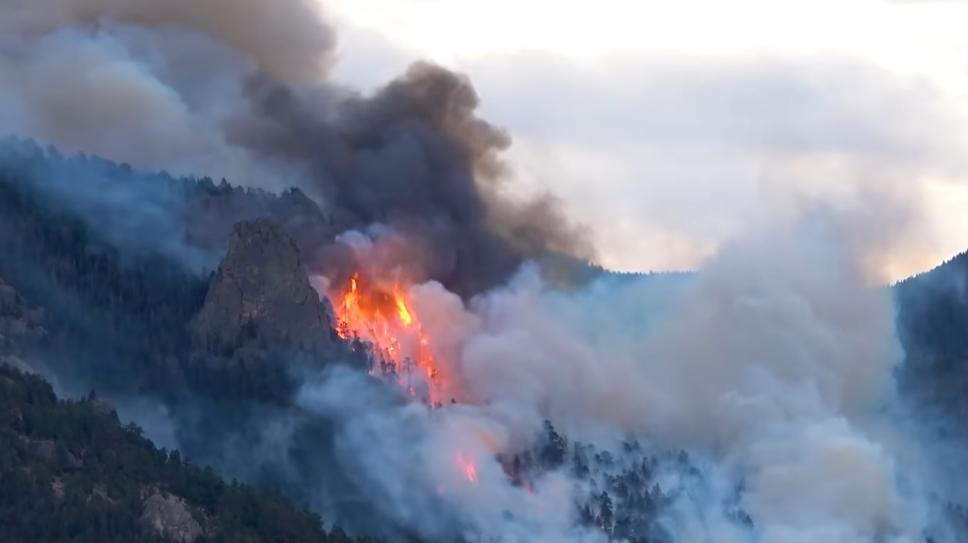 Wind driven fire climbs Kruger Rock near Estes Park.