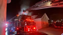 Aerials operate during a house fire that badly burned Manchester, NH, Fire Capt. Steve DesRuisseaux on Saturday, Nov. 6, 2021. Aerials operate during a house fire that badly burned Manchester, NH, Fire Capt. Steve DesRuisseaux on Saturday, Nov. 6, 2021.