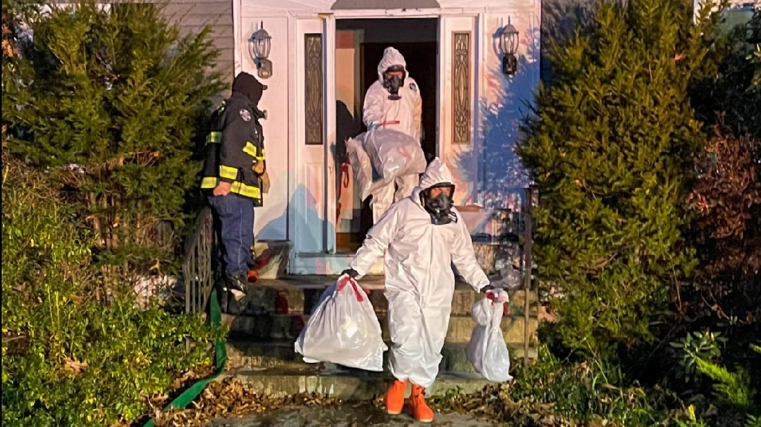 Mansfield, MA, responders remove contents from a possible meth lab discovered at a residential fire on Nov. 23, 2021