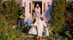 Mansfield, MA, responders remove contents from a possible meth lab discovered at a residential fire on Nov. 23, 2021