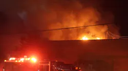 Modesto crews arrive to flames through the roof of a two-alarm fire on Nov. 20, 2021.
