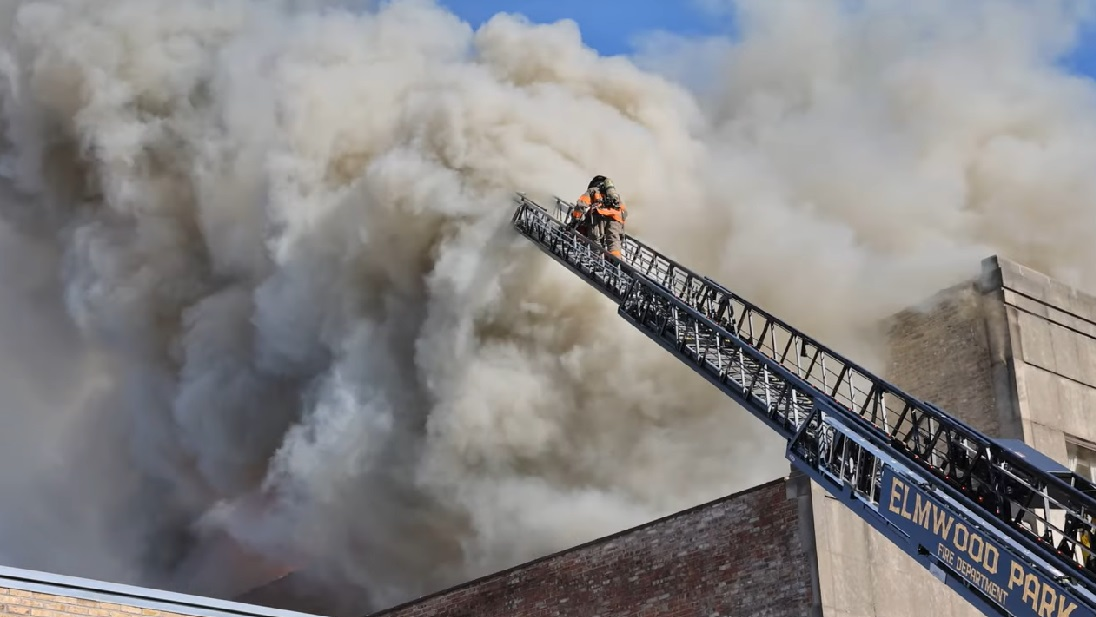 Firefighters battle a major structure fire that damaged businesses and apartments in Oak Park, IL, on Nov. 23, 2021.