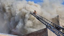 Firefighters battle a major structure fire that damaged businesses and apartments in Oak Park, IL, on Nov. 23, 2021.