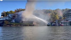 Fire boat from Lake Ozark Fire Protection District uses master streams to combat the fire. Fire boat from Lake Ozark Fire Protection District uses master streams to combat the fire.