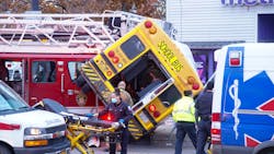 Buffalo firefighters work to extricate two injured adults from a school bus after it was T-boned by a ladder truck responding to a fire on Tuesday Nov. 16, 2021. Buffalo firefighters work to extricate two injured adults from a school bus after it was T-boned by a ladder truck responding to a fire on Tuesday Nov. 16, 2021.