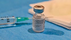 A Pfizer-BioNtech COVID-19 vaccine vial. A Pfizer-BioNtech COVID-19 vaccine vial.