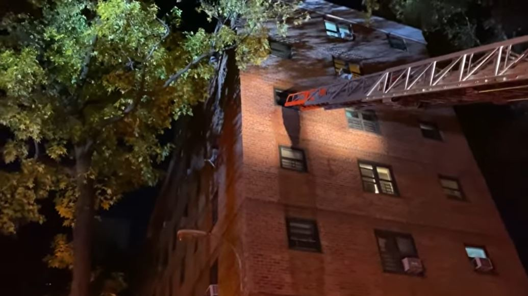 An FDNY aerial ladder is extended to a window in a fourth-floor Upper West Side apartment where two people died in a fire on Thursday, Nov. 11, 2021.