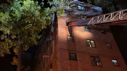 An FDNY aerial ladder is extended to a window in a fourth-floor Upper West Side apartment where two people died in a fire on Thursday, Nov. 11, 2021.
