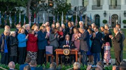 President Joe Biden and lawmakers on the South Lawn of the White House as he signs legislation into law that will benefit the fire and emergency services. President Joe Biden and lawmakers on the South Lawn of the White House as he signs legislation into law that will benefit the fire and emergency services.