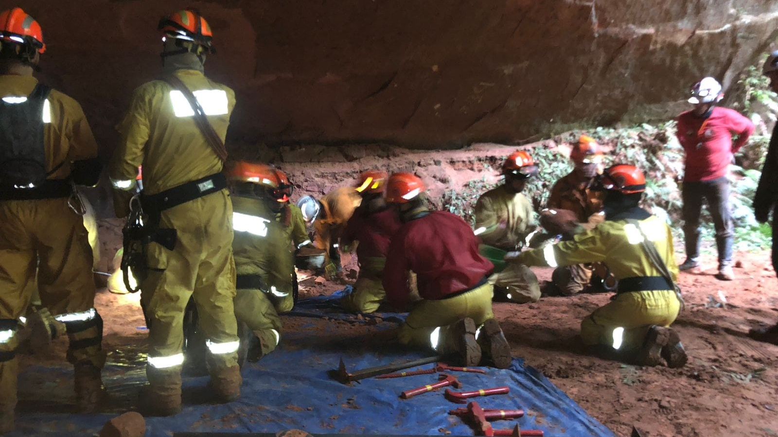 Rescue crews on scene after a cave collapse that killed nine firefighters near the southern Brazilian town of Altinopolis on Sunday, Oct. 31, 2021.