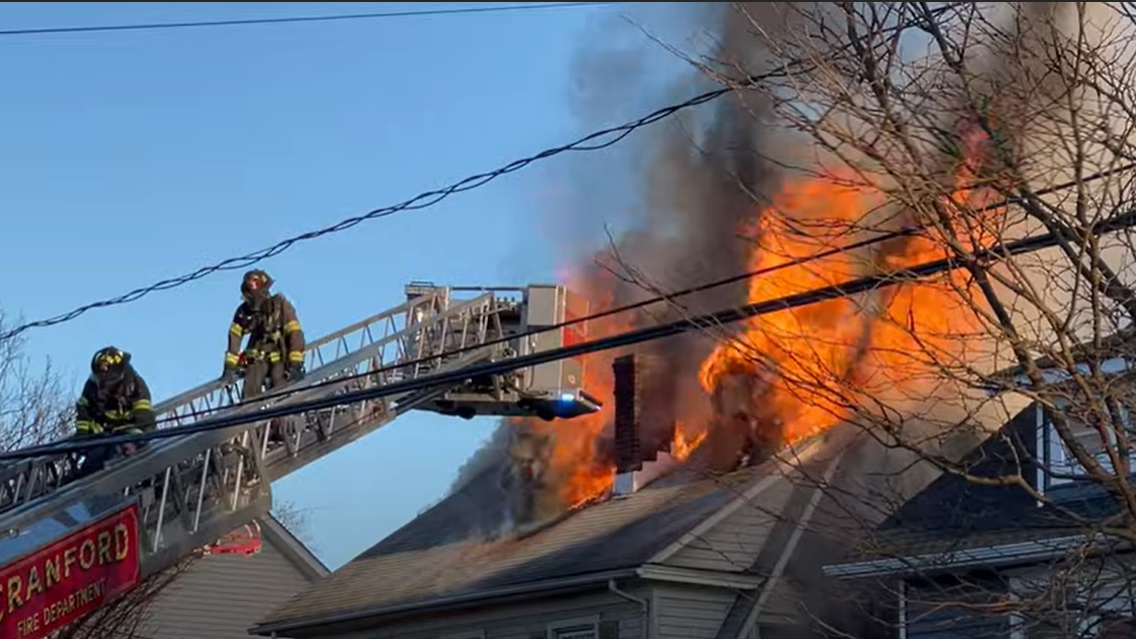 Cranford, NJ, firefighters work to control a blazing house fire that claimed the life of one person on Nov. 23, 2021.