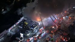 Firefighters battle a fire at a strip mall in the Koreatown section of Los Angeles on Thursday, Nov. 4, 2021. Firefighters battle a fire at a strip mall in the Koreatown section of Los Angeles on Thursday, Nov. 4, 2021.