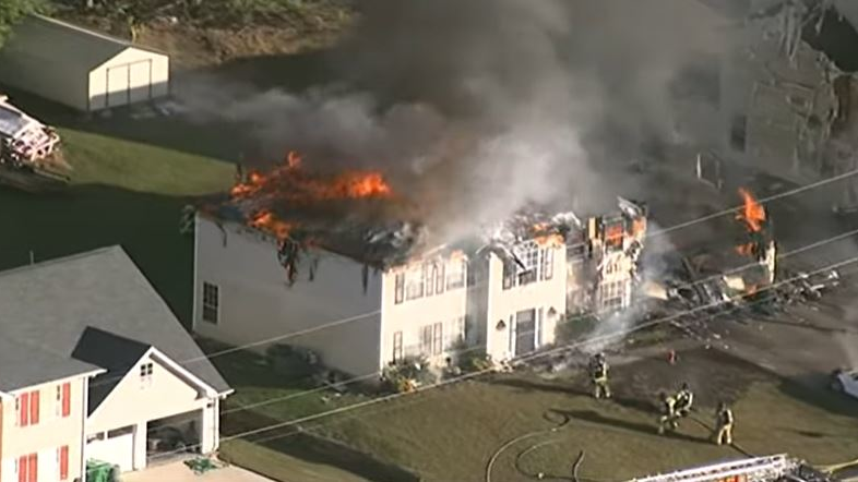 A home burns in Lithonia, GA, on Monday, Nov. 1, 2021.