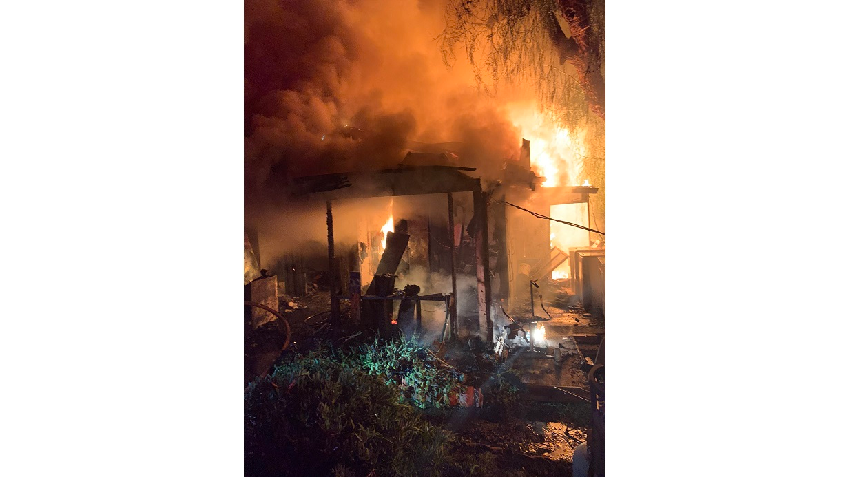 A home is engulfed in flames during a fatal fire in Ramona, CA, on Monday, Nov. 15, 2021.