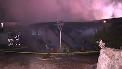 Smoke rises from a Santee, CA, home that burned in a suspected arson fire on Saturday, Nov. 6, 2021. Smoke rises from a Santee, CA, home that burned in a suspected arson fire on Saturday, Nov. 6, 2021.