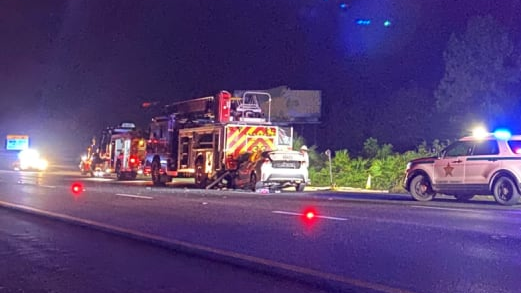 A vehicle sits crumpled beneath the rear of a Sumter County fire apparatus after a woman crashed into the parked rig and died on Friday, Nov. 12, 2021.