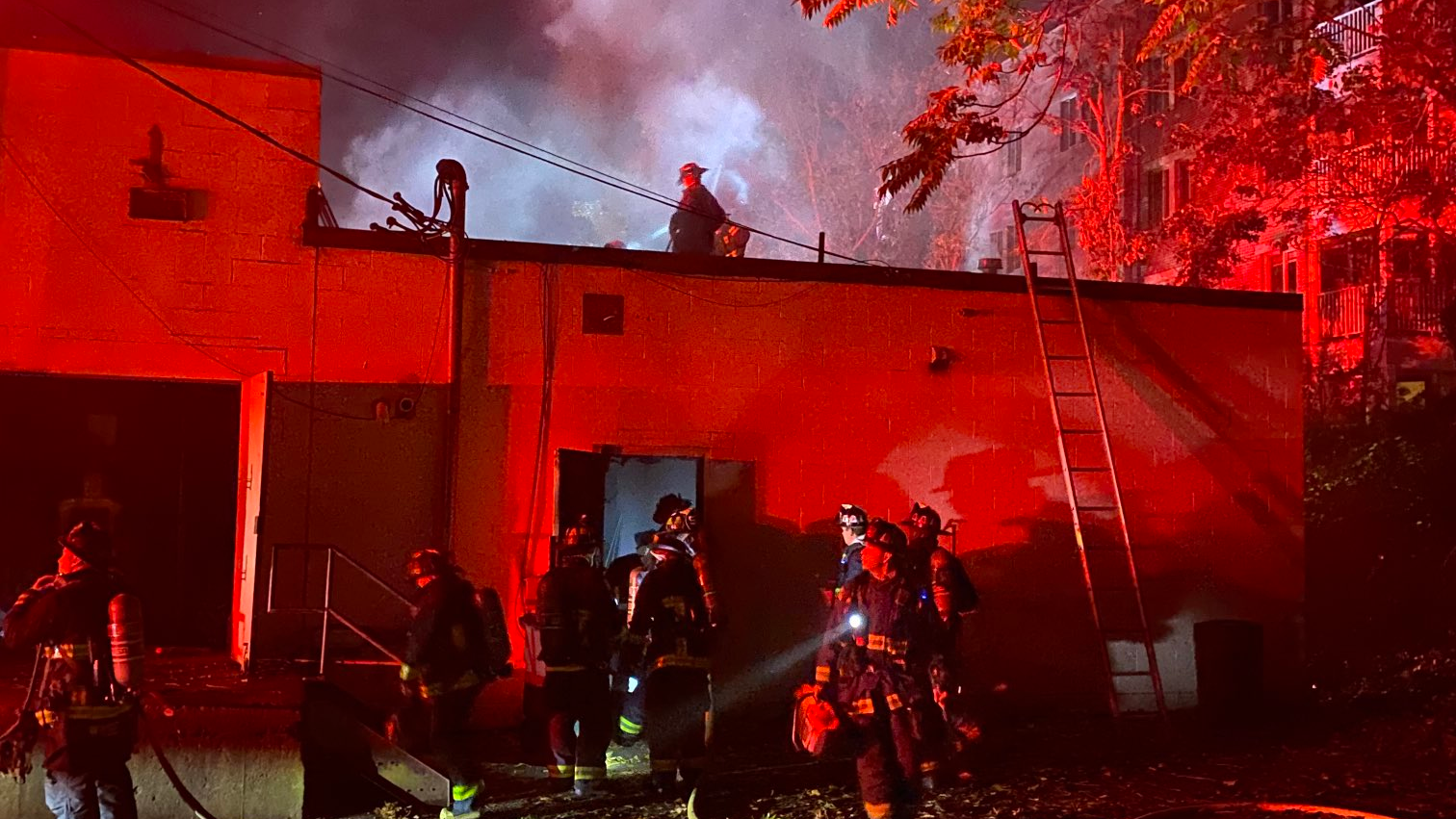 Boson firefighters work to extinguish a fire that broke out a shuttered yoga studio on Monday, Nov. 1, 2021.
