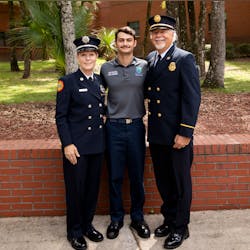 Christie Treiber Donn (left) with her grandson, Tomas Rodriguez (who recently graduated from Florida State Fire College), and her husband, Mickey Donn. Christie Treiber Donn (left) with her grandson, Tomas Rodriguez (who recently graduated from Florida State Fire College), and her husband, Mickey Donn.