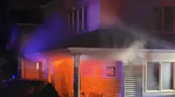 Smoke can be seen rising from a home during a reported basement fire that injured a firefighter in Valley Cottage, NY, on Monday, Nov. 1, 2021.