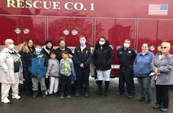 Family gathers with two of the Syracuse firefighters who saved three of them when from a 1998 apartment fire. From left: Lori Holmes, Christina Micheletti, Brendan Roberts, Allayna Johnson, Anna Curtis, Mason and Quentin Johnson, Mark Hatch, Jordan Micheletti, Bob Tangredi, Lisa Curtis, and Lisa Micheletti. Family gathers with two of the Syracuse firefighters who saved three of them when from a 1998 apartment fire. From left: Lori Holmes, Christina Micheletti, Brendan Roberts, Allayna Johnson, Anna Curtis, Mason and Quentin Johnson, Mark Hatch, Jordan Micheletti, Bob Tangredi, Lisa Curtis, and Lisa Micheletti.